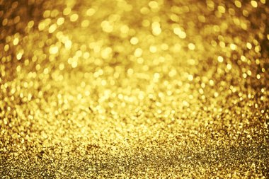 Altın parıltılı bokeh aydınlatma dokusu doğum günü, yıldönümü, düğün, yeni yıl arifesi veya Noel için soyut arkaplanı bulanıklaştırdı