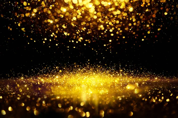 Altın parıltılı bokeh aydınlatma dokusu doğum günü, yıldönümü, düğün, yeni yıl arifesi veya Noel için soyut arkaplanı bulanıklaştırdı