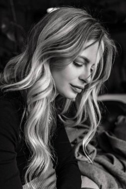 Close up portrait a beautiful woman with curly hair.