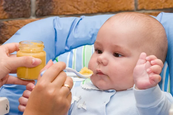 Baby boy while mother feeding — Stock Photo, Image