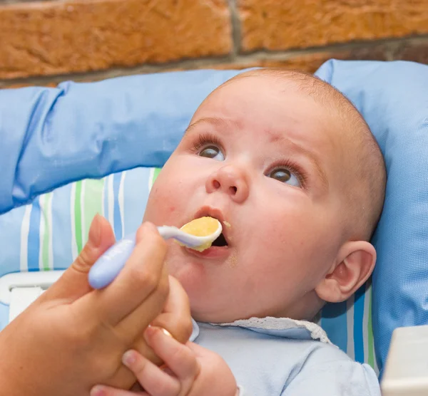 Baby boy while mother feeding — Stock Photo, Image