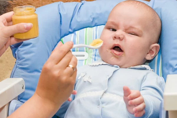 Baby boy while mother feeding — Stock Photo, Image