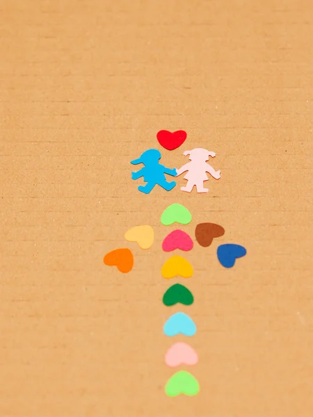 Seta de lareiras de papel multicoloridas e menino e menina de papel — Fotografia de Stock