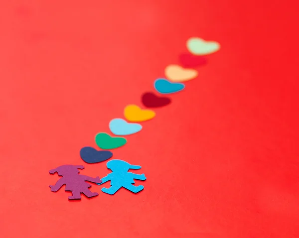 Πολύχρωμα χαρτί αγόρι και κορίτσι με πολύχρωμα χαρτί εστίες — Φωτογραφία Αρχείου