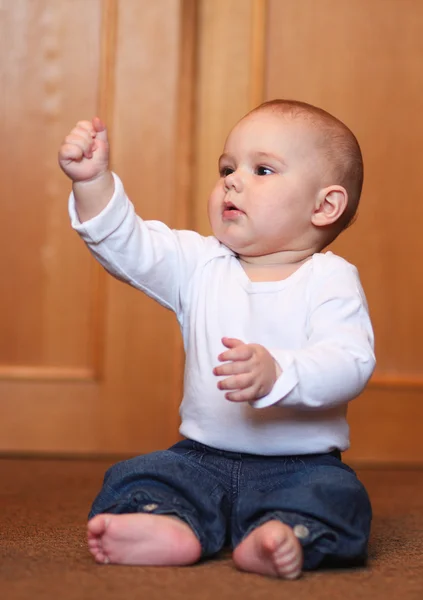 Baby boy playing with christmas tree — Stock Photo, Image