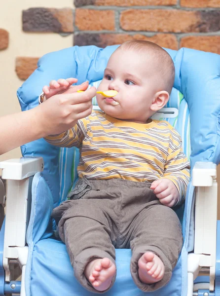 Feeding a baby Stock Image