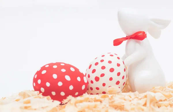 Easter porcelain bunny with eggs — Stock Photo, Image