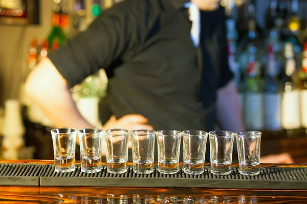 Barman making drink shots — Stock Photo, Image