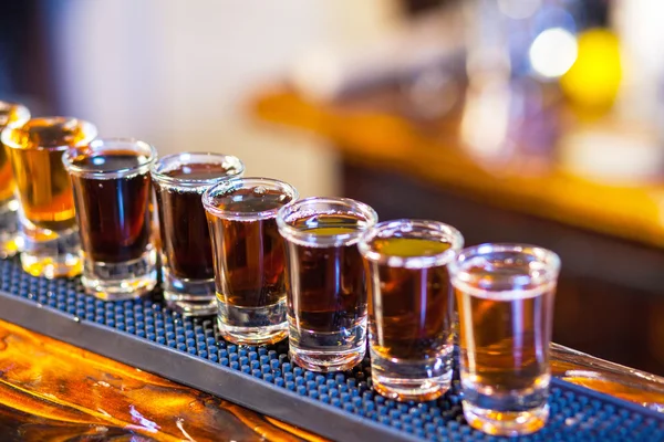 Barman making drink shots — Stock Photo, Image