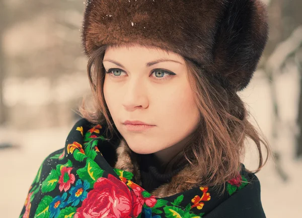 Beautiful girl in a fur hat — Stock Photo, Image