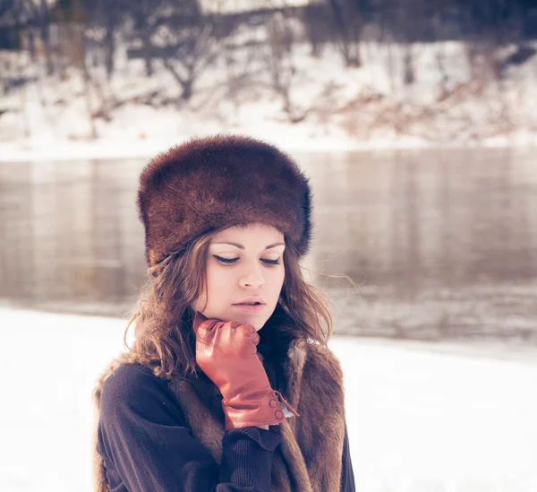 Beautiful girl in a fur hat — Stock Photo, Image