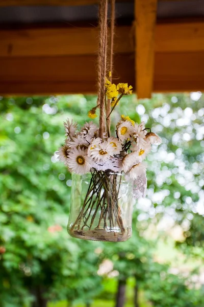 vintage bouquet of dried flowers in a jar