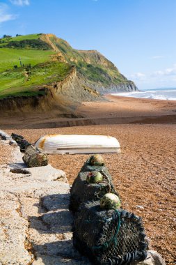 Lobster pots and boats on Seatown beach Dorset clipart