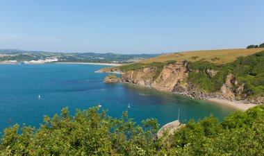 View from Polkerris Cornwall England to Par beach on a beautiful summer day clipart