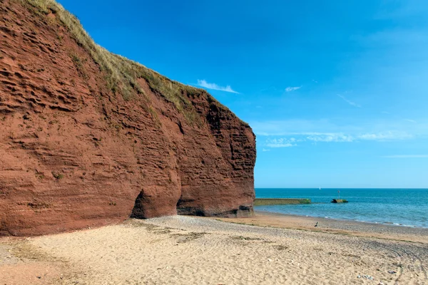 Playa de roca roja cerca de Dawlish Warren Devon Inglaterra — Foto de Stock