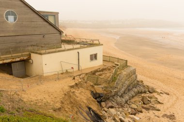 FISTRAL BEACH NEWQUAY CORNWALL-MARCH 14TH 2014:  The damage caused to the café and retail units on Fistral beach by the storms of 3rd January 2014 remains unrepaired