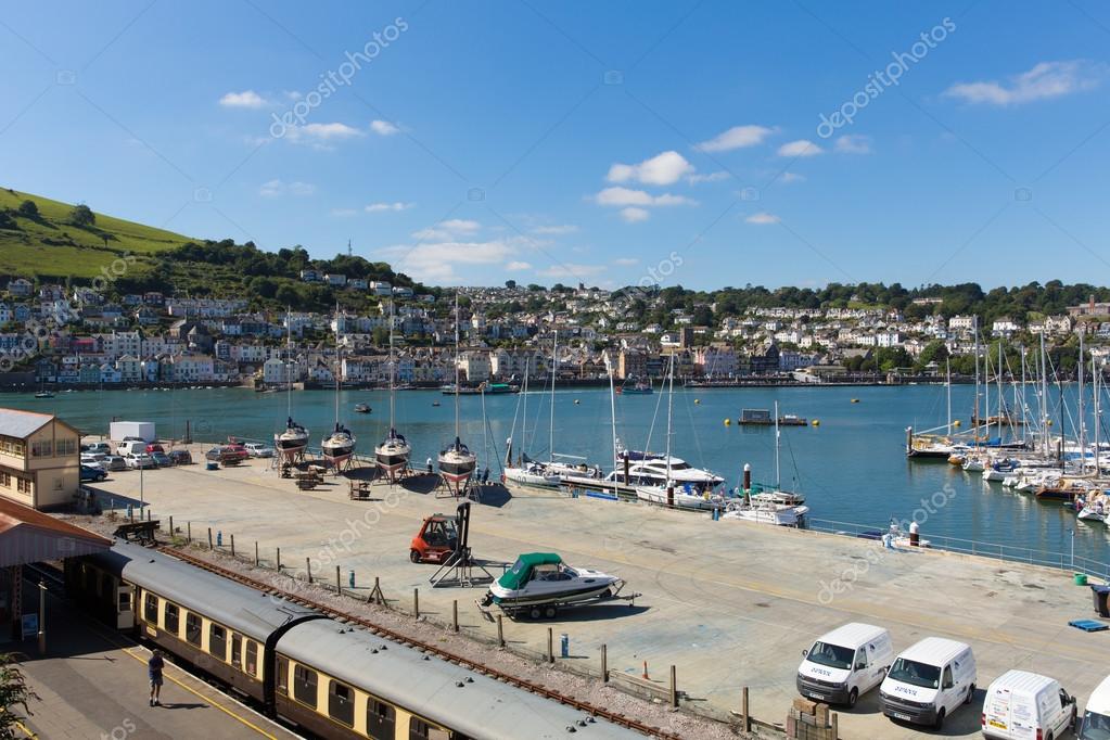 Dartmouth and Kingswear train station with colourful yellow carriages ...