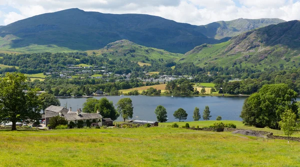 Coniston Water Lake District England uk with mountains and blue sky and white clouds on a beautiful summer day — Stockfoto