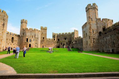 Fine late summer weather was enjoyed by people visiting Caernarfon, Wales, UK on Wednesday 7th September 2016 clipart