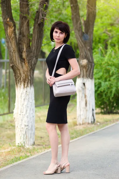 Slender Brunette Black Dress Slit Waist Walks Street Sunny City — Stock Photo, Image
