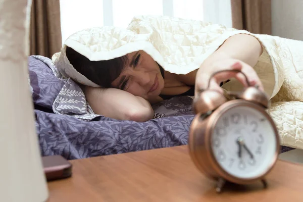 Sleepy Sleepless Woman Reluctantly Reaches Out Blanket Alarm Clock — Stock Photo, Image