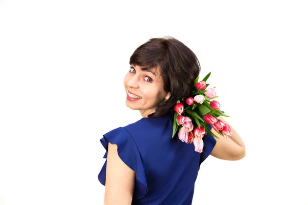 Una Mujer Con Una Blusa Azul Sostiene Ramo Tulipanes Vista —  Fotos de Stock