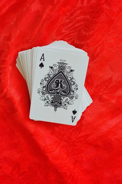 Cards on red felt — Stock Photo, Image