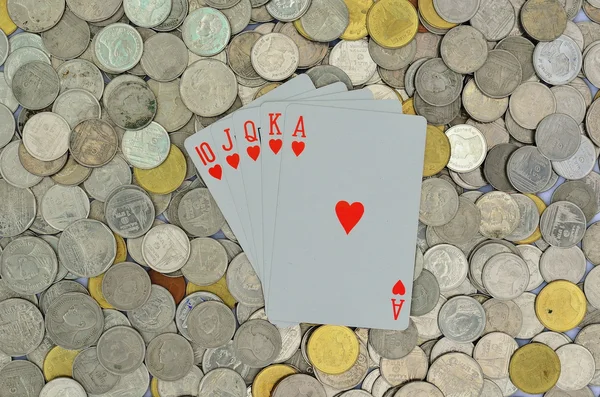 Poker kaart en munten — Stockfoto