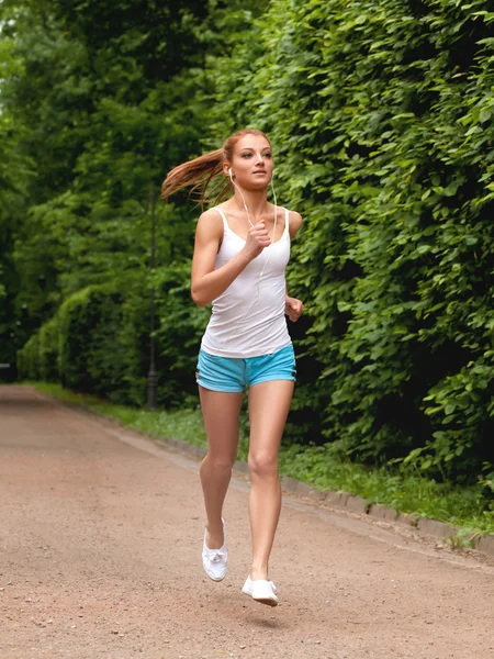 Woman Runner. Fitness Girl Running outdoors Stock Picture