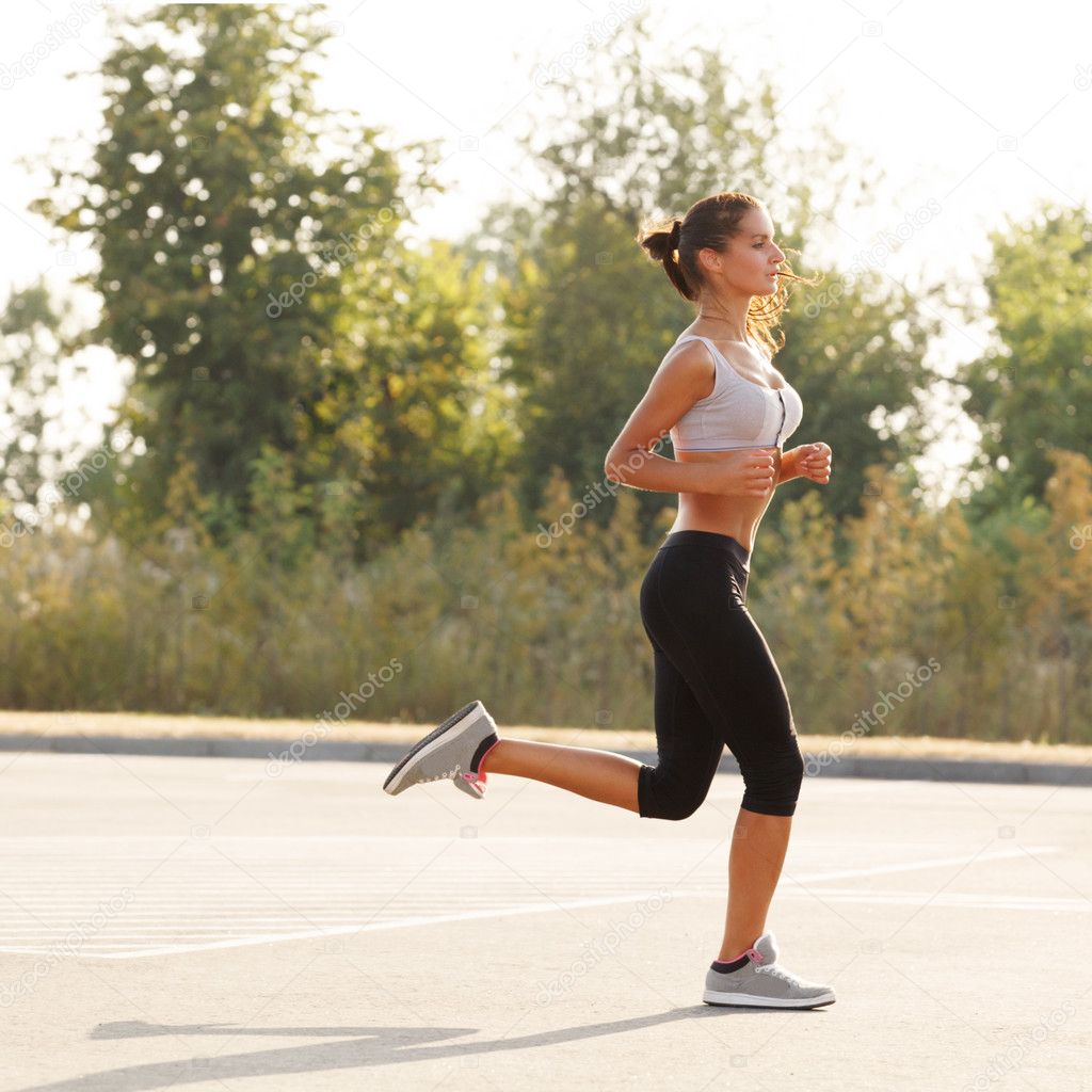 Woman Runner. Fitness Girl Running outdoors