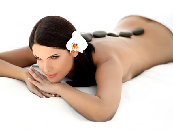 Stone Massage. Beautiful Woman Getting Spa Hot Stones Massage. S — Stock Photo, Image