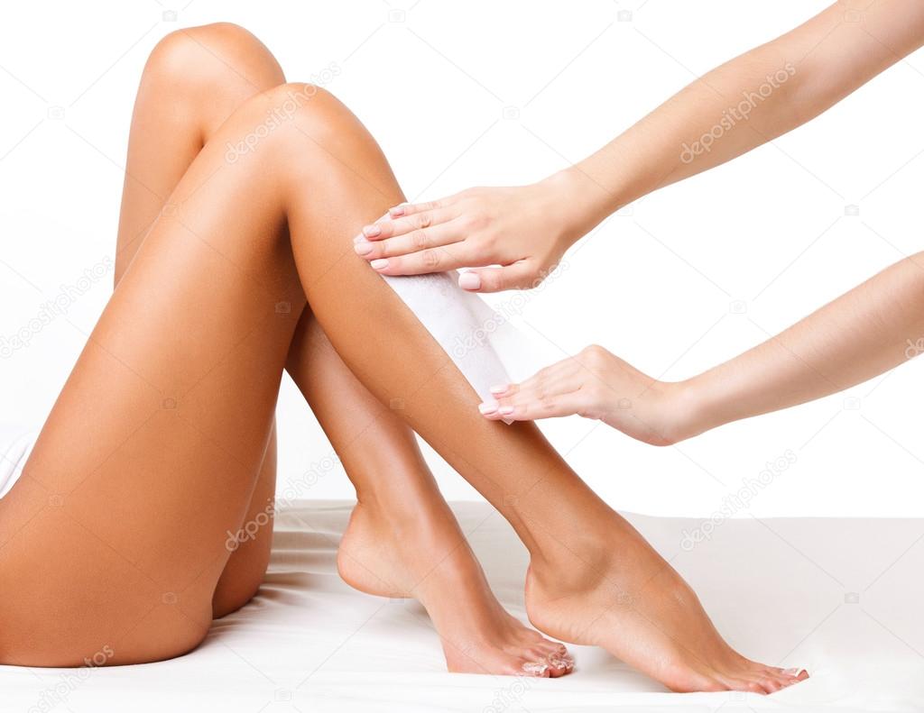 Well-groomed Woman Legs After Depilation Isolated on White