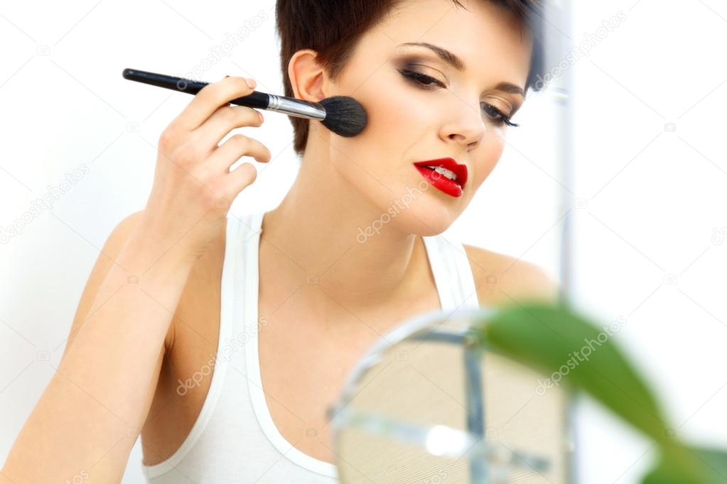 Beauty Girl with Makeup Brush and Red Lips