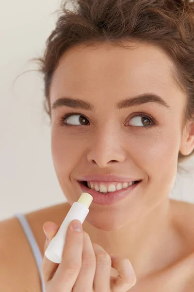 Lips Care Pretty Young Woman Brown Hair Looking Aside Grey — Stock Photo, Image