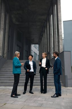 Business People Having Conversation with Colleagues During Break. Coworkers Discussing Ideas for Future Project Together. Business Team Concept 