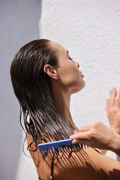 Hair Treatment. Woman With Mask On Wet Hair Closeup. Beautiful Woman Brushing Wet Long Hair After Bath at the Street