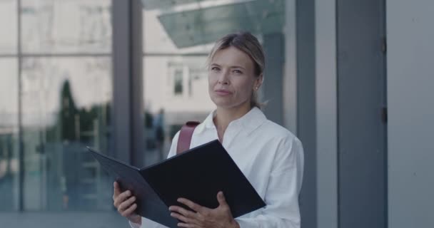 Medium Portrait Senior Entrepreneur Standing Street Smart Woman Reading Folder Royalty Free Stock Video