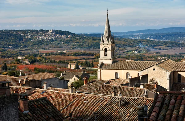 Cathedral of Bonnieux and Lacoste village — Stock Photo, Image