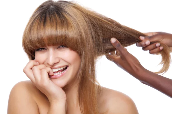 Smiling beauty getting her hair done — Stock Photo, Image