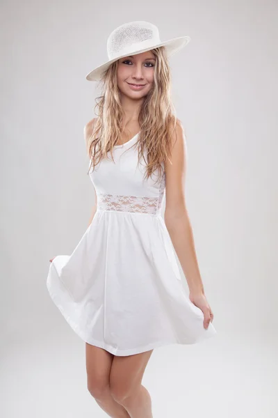 Young woman in a white dress — Stock Photo, Image