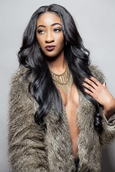 Beautiful black woman with long curly hair — Stock Photo, Image