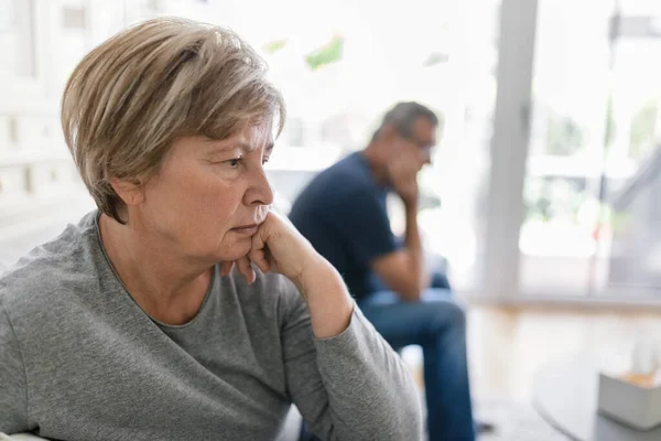 Upset Senior Couple Home Living Room Having Argument Stock Image