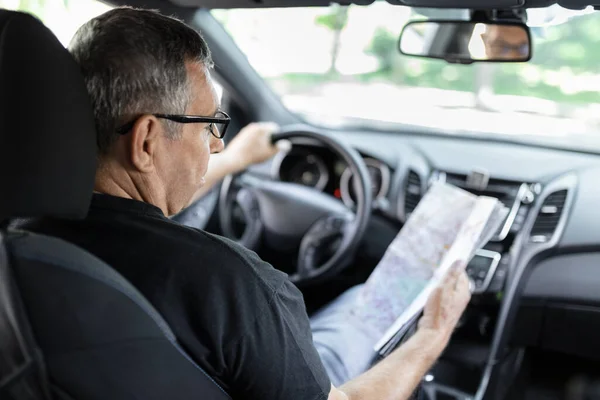 Senior Steering Wheel Car Looking Map Directions — Zdjęcie stockowe