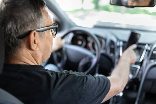 Senior Steering Wheel Using Navigation Looking Directions — Fotografia de Stock
