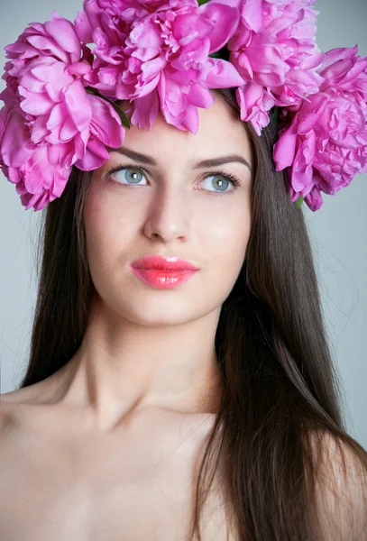 Beautiful woman wearing a flower wreath