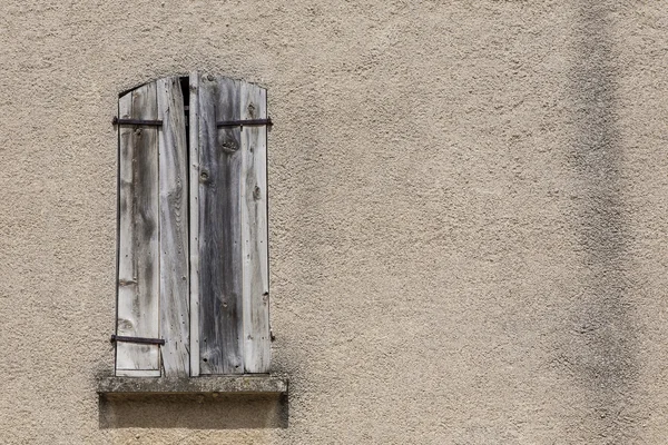 Closed wooden shutters on window — Stock Photo, Image