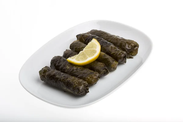 Stuffed grape leaves with olive oil — Stock Photo, Image