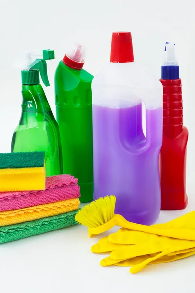 Colorful cleaning set for different surfaces in kitchen, bathroom and other rooms. Empty place for text or logo on isolated background. Cleaning service concept. Early spring regular clean up.