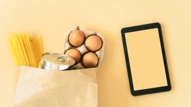 digital tablet with the eco bag and fresh vegetable. online grocery and organic farmer product shopping application. food and cooking recipe or nutrition counting.flat lay.