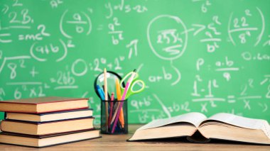 School books and pencils on desk, education concept